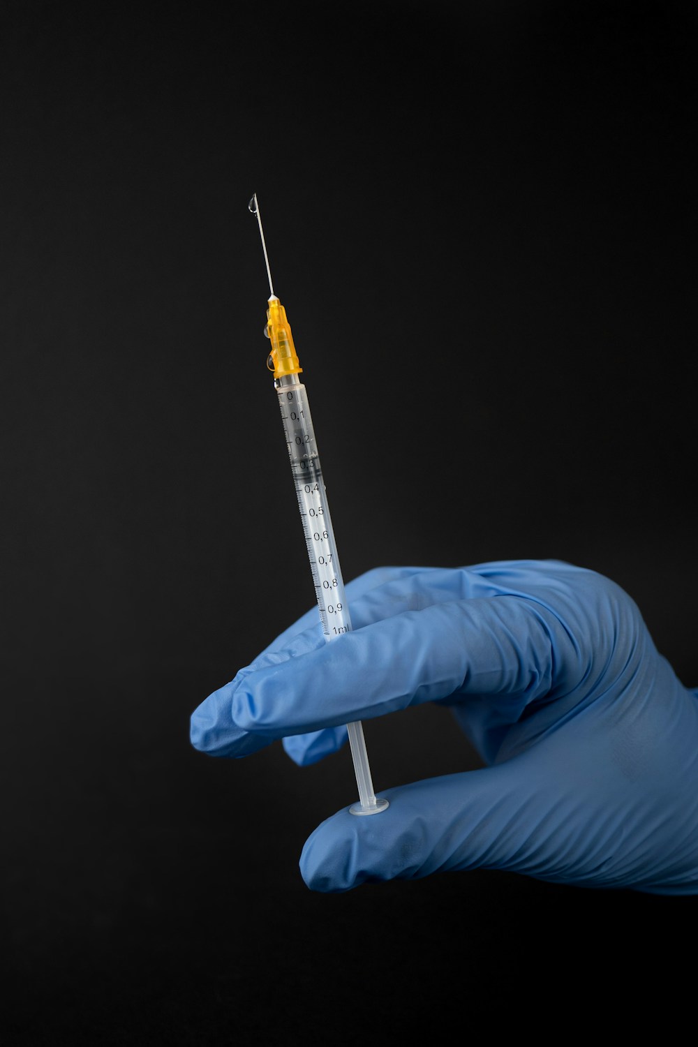 Steroid injection syringe — bodybuilder administering injectable compound